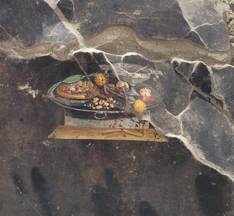 Descubren la representación de un posible antepasado de la pizza en un fresco en Pompeya Descubren la representación de un posible antepasado de la pizza en un fresco en Pompeya
