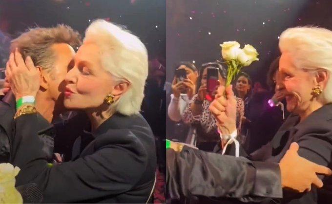 Carolina Herrera recibe flores y un beso de Luis Miguel